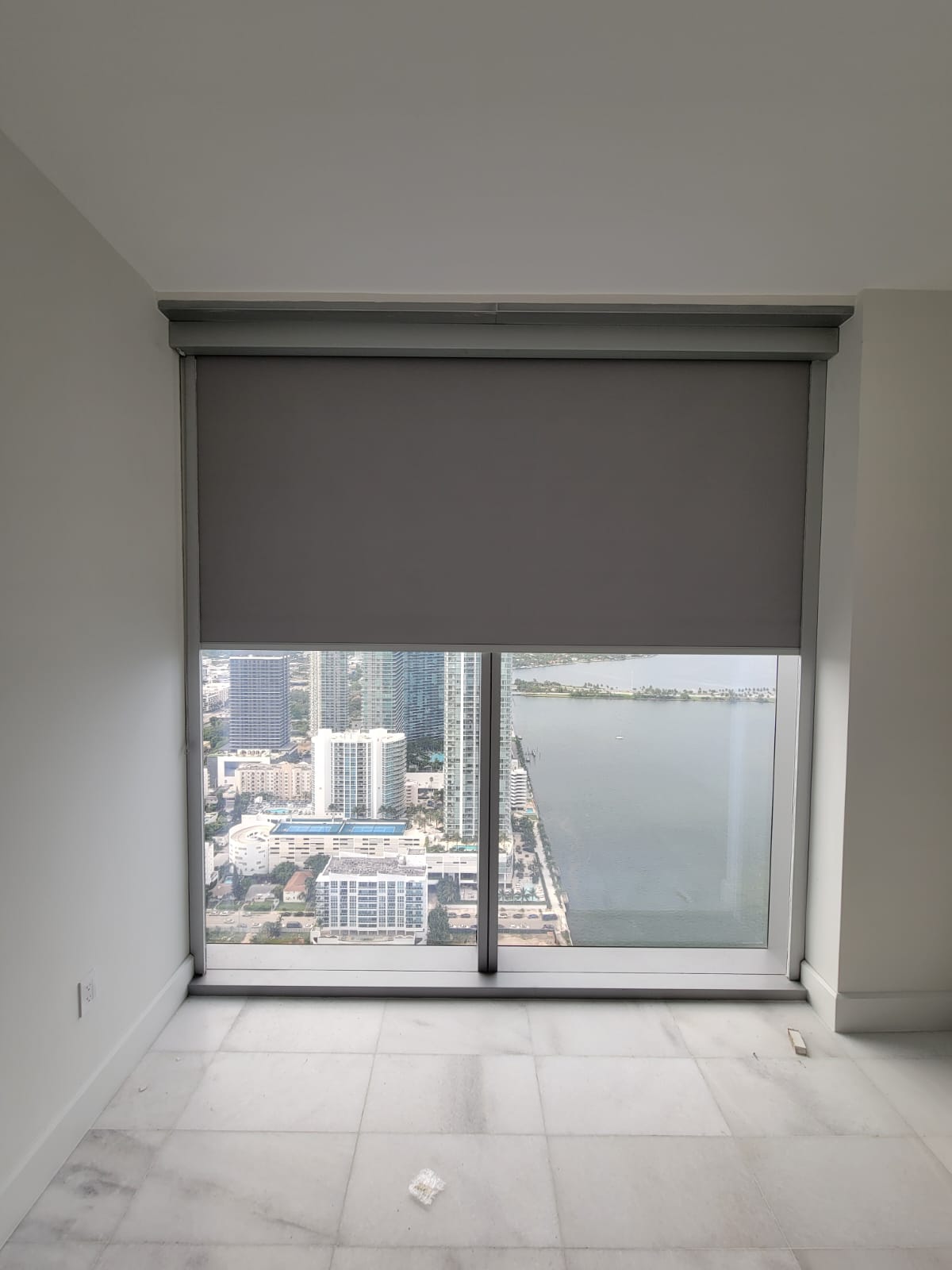 Missoni Baia bedroom with a wide room-darkening roller shade