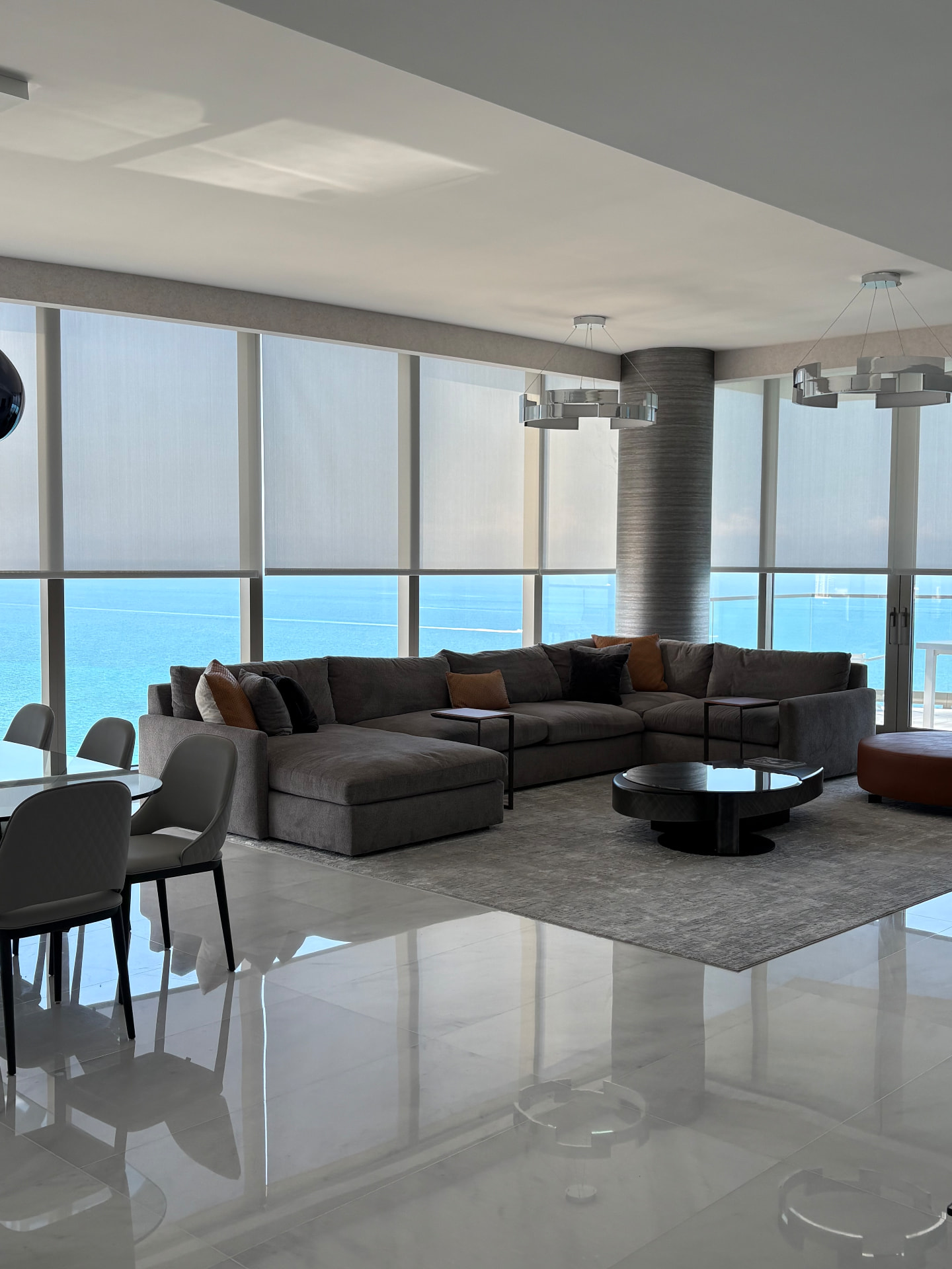 Aria Reserve oceanfront living room with solar roller shades
