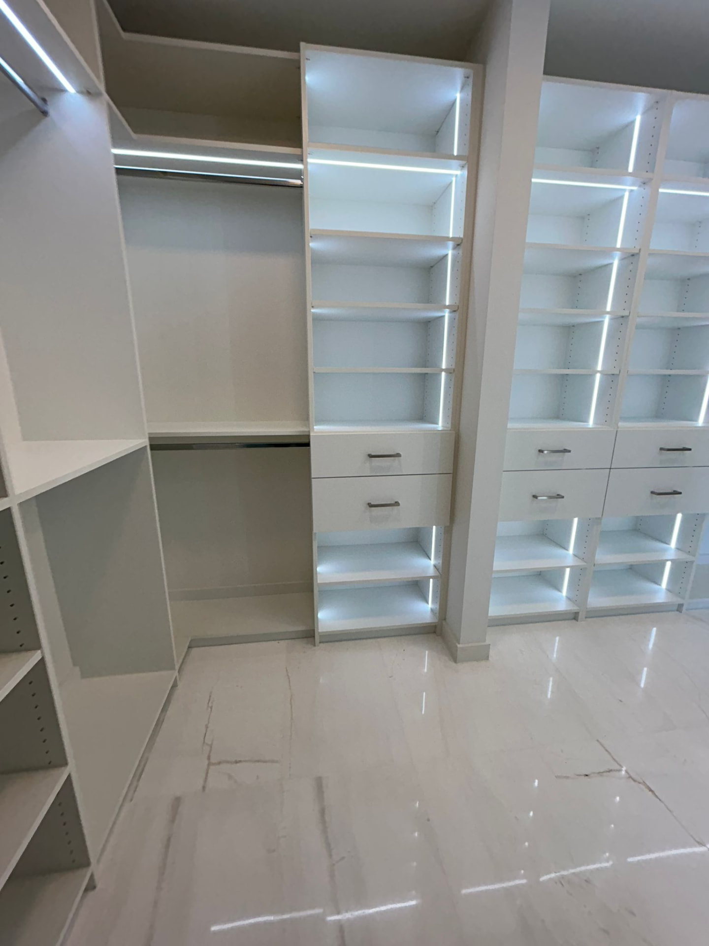 Aston Martin Residences white walk-in closet with integrated lighting